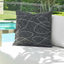 Uttermost Loopy Loop Outdoor Pillow – Onyx ground with sandy abstract loops in Sunbrella fabric