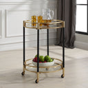 Uttermost Dolly Round Bar Cart – matte black iron with soft gold-leaf accents, two glass shelves & rolling locking casters 