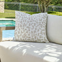 Uttermost Scatter Abstract Outdoor Pillow – cream woven ground with multi-tonal putty abstract shapes in Sunbrella solution-dyed acrylic 