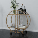 Uttermost Zelina Gold Bar Cart – hand-forged iron frame with hammered antique gold finish and clear tempered glass shelves