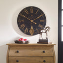 Uttermost Bond Street 30" Wall Clock – Black – weathered crackled black face with cast brass details and internal pendulum