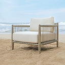 Uttermost Borneo Outdoor Lounge Chair – weathered dark gray mahogany frame with hand-wrapped charcoal gray rope and oyster white cushions