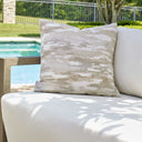 Uttermost Abstract Waves Outdoor Pillow – woven Sunbrella fabric with warm flax, putty, cream waves pattern 